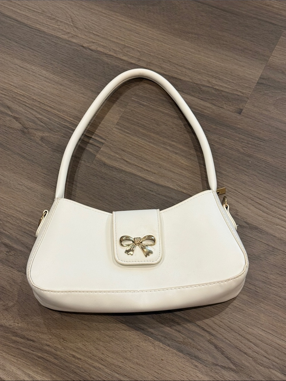 Classic White Shoulder Bag with Gold Bow Accent
